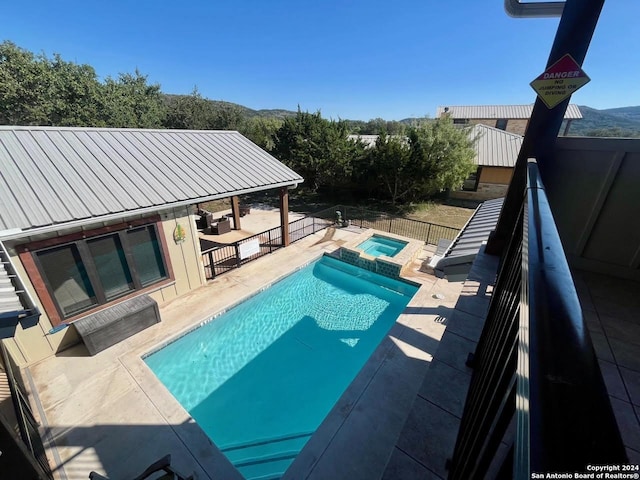 236 Tequila Sunrise, Concan, TX 78838 - view of swimming pool featuring a patio area, a pool with connected hot tub, and fence