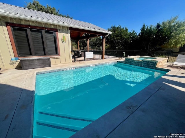 236 Tequila Sunrise, Concan, TX 78838 - view of swimming pool featuring a patio, fence, and a pool with connected hot tub