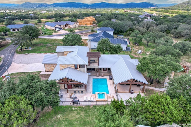 236 Tequila Sunrise, Concan, TX 78838 - aerial view of property and surrounding area with a mountainous background and a pool