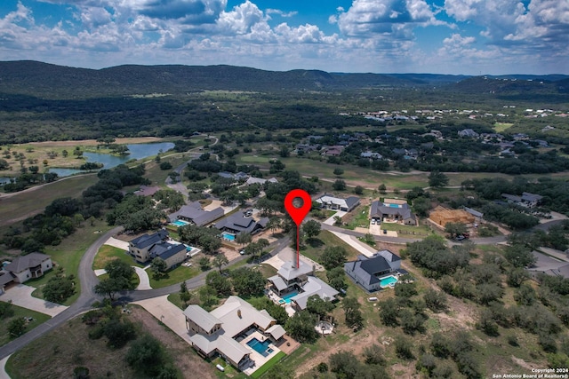236 Tequila Sunrise, Concan, TX 78838 - aerial view of property's location with a water and mountain view and nearby suburban area