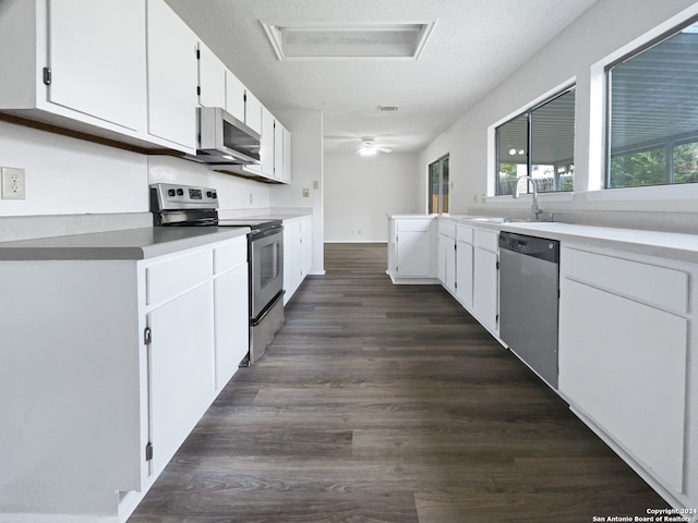 kitchen featuring a textured ceiling, white cabinetry, stainless steel appliances, sink, and dark hardwood / wood-style floors