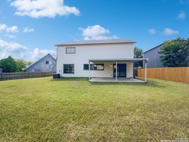 back of house with a yard, a patio, and central AC unit