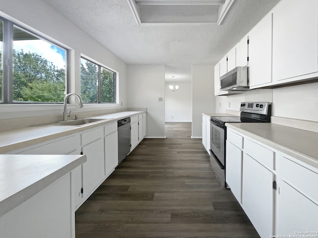 kitchen featuring a textured ceiling, sink, dark wood-type flooring, appliances with stainless steel finishes, and white cabinets