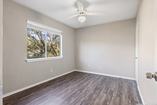 unfurnished room featuring dark hardwood / wood-style floors and ceiling fan