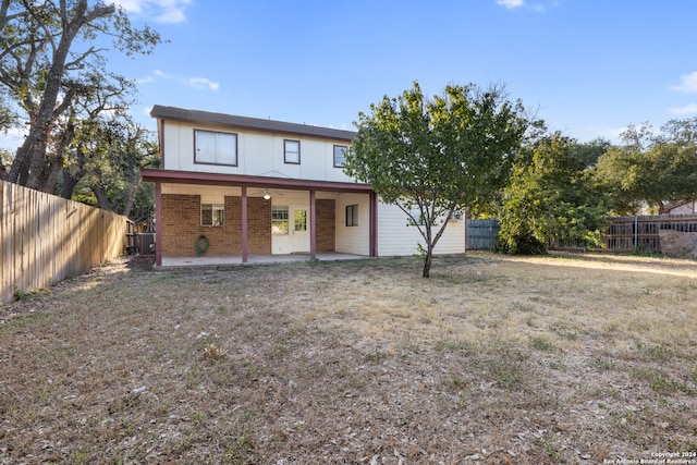 back of property with a patio area