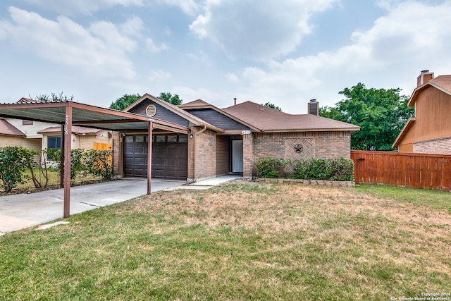 view of front facade featuring a garage and a front yard