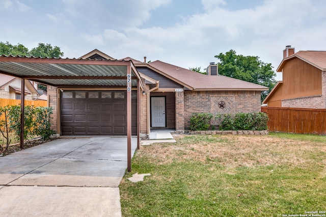 view of front facade with a garage and a front lawn