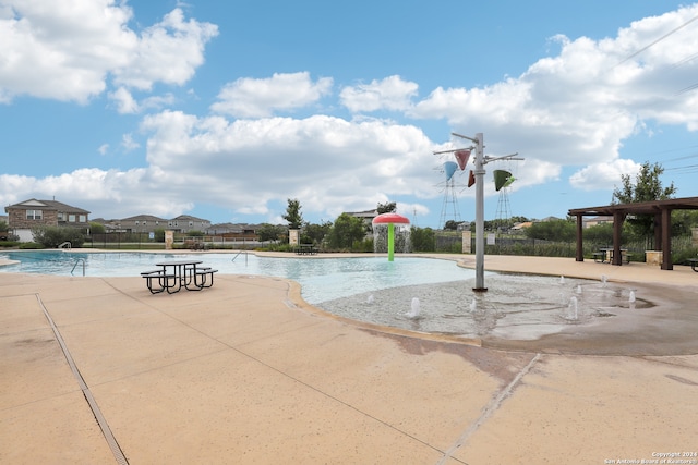 view of pool featuring a patio area and pool water feature