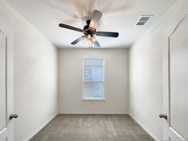 rear view of property featuring a lawn and central air condition unit