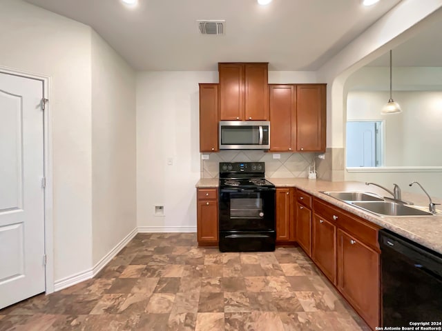 kitchen with black appliances, backsplash, sink, and hanging light fixtures