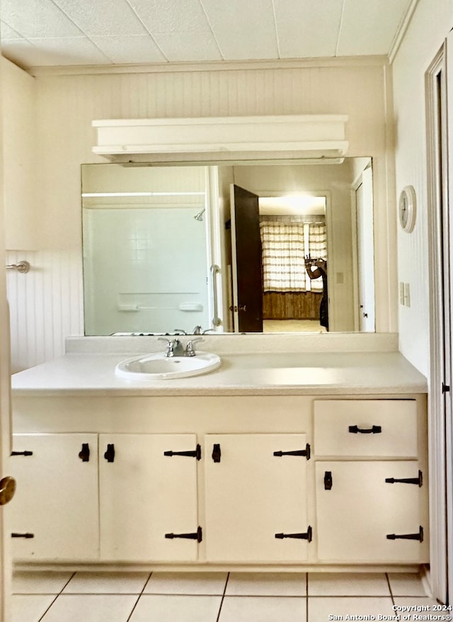 bathroom with vanity and tile patterned flooring