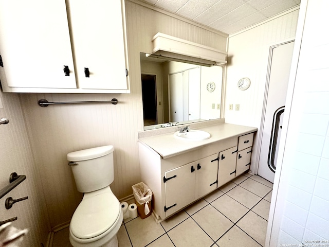 bathroom with tile patterned flooring, toilet, and vanity