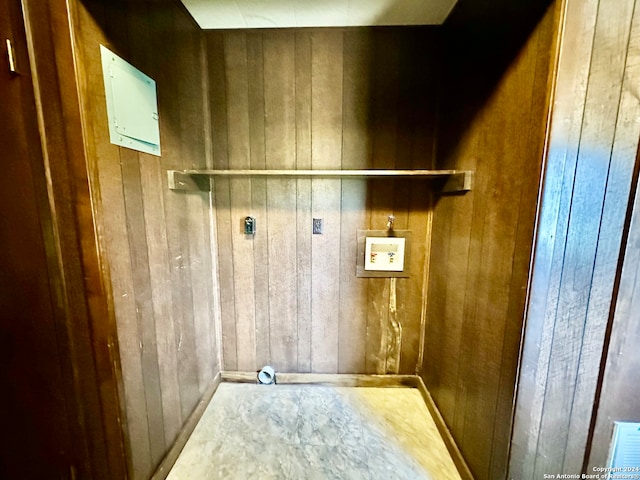 washroom featuring washer hookup, wood walls, and hookup for an electric dryer