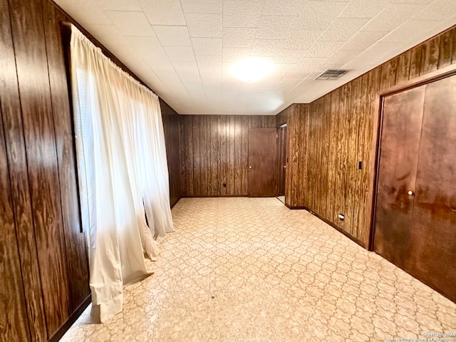 interior space featuring wooden walls