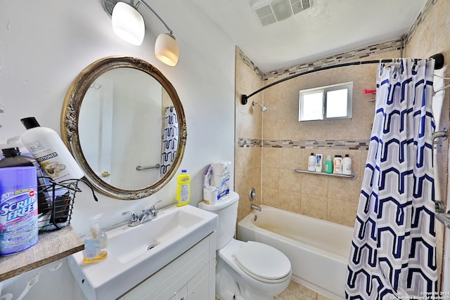 full bathroom with shower / bath combo with shower curtain, toilet, and vanity