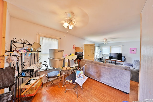 living area featuring wood finished floors and a ceiling fan