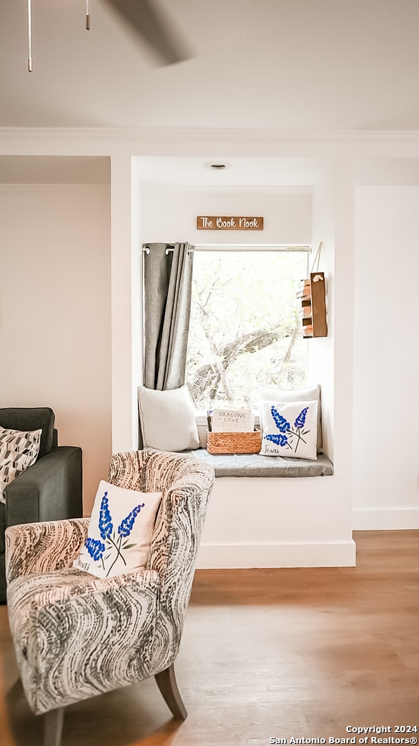 living area with hardwood / wood-style flooring