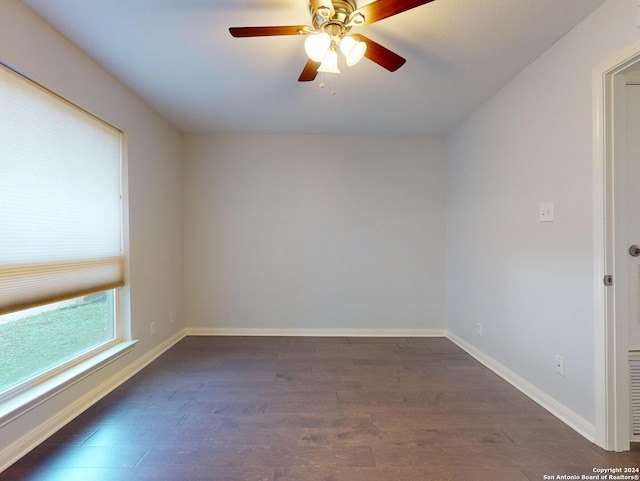 unfurnished room with ceiling fan and dark hardwood / wood-style floors