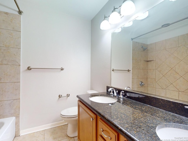 full bathroom with toilet, tile patterned flooring, tiled shower / bath combo, and vanity