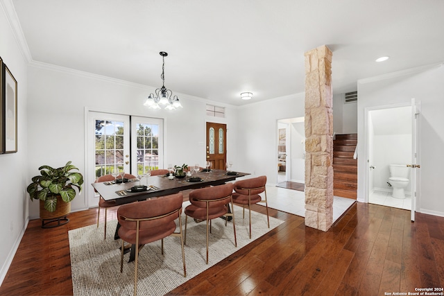 dining room featuring french doors, dark hardwood / wood-style floors, and crown molding