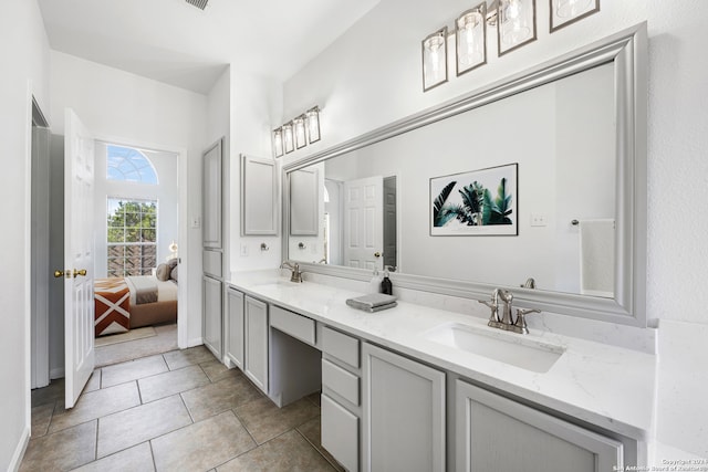 bathroom featuring tile patterned flooring and vanity