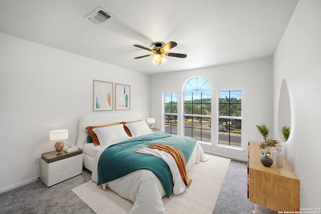 carpeted bedroom with ceiling fan