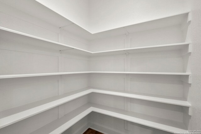 unfurnished bedroom with light carpet and a closet