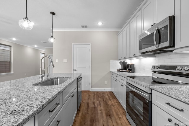 kitchen featuring crown molding, stainless steel appliances, sink, light stone countertops, and dark wood-type flooring