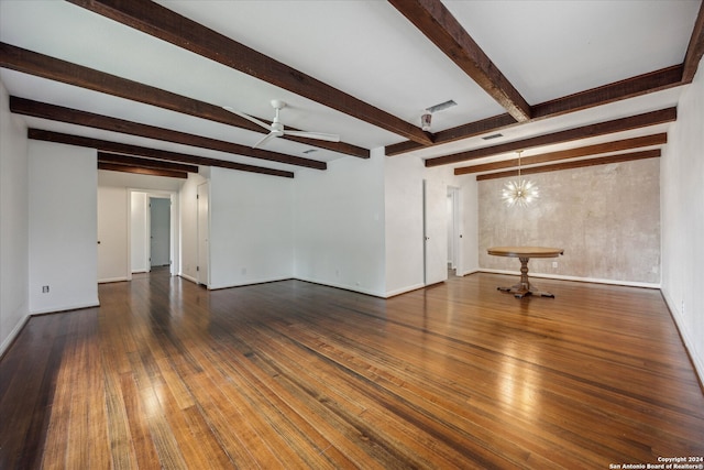 unfurnished living room featuring beamed ceiling, ceiling fan with notable chandelier, and dark hardwood / wood-style flooring