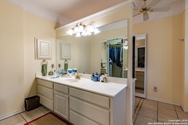 bathroom featuring ceiling fan with notable chandelier, tile patterned flooring, and vanity