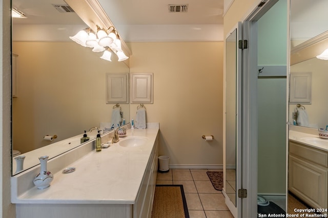 bathroom with tile patterned floors and vanity