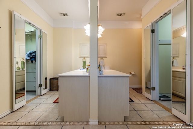 interior space featuring vanity and tile patterned floors