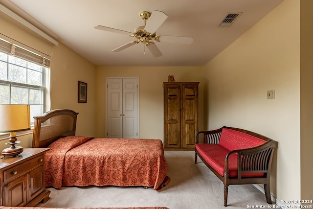 bedroom featuring a closet, ceiling fan, and carpet