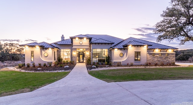 view of front of home with a lawn