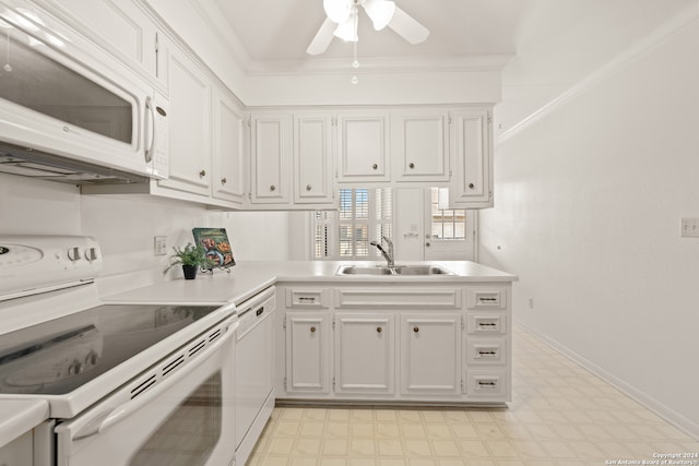 kitchen with white appliances, ceiling fan, white cabinetry, and sink