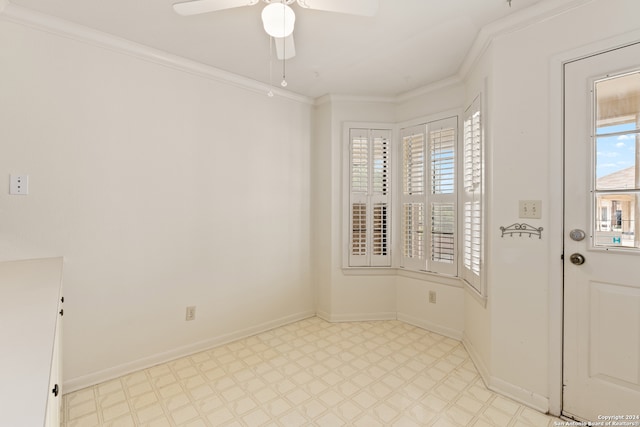 interior space with ceiling fan and ornamental molding