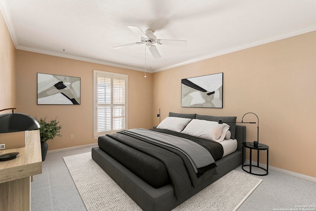 carpeted bedroom with crown molding and ceiling fan