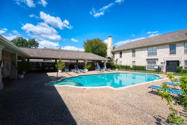 view of swimming pool featuring a patio area