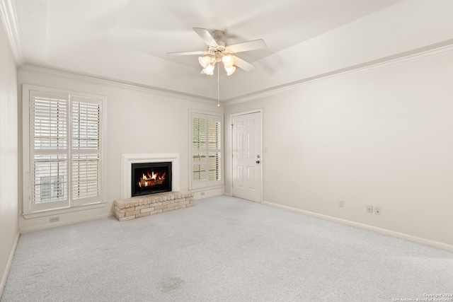 unfurnished living room featuring ceiling fan, carpet, and a brick fireplace