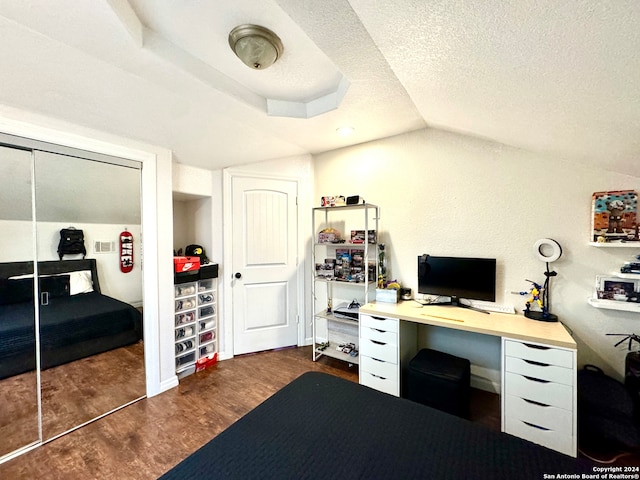 office with vaulted ceiling, a textured ceiling, and dark hardwood / wood-style floors