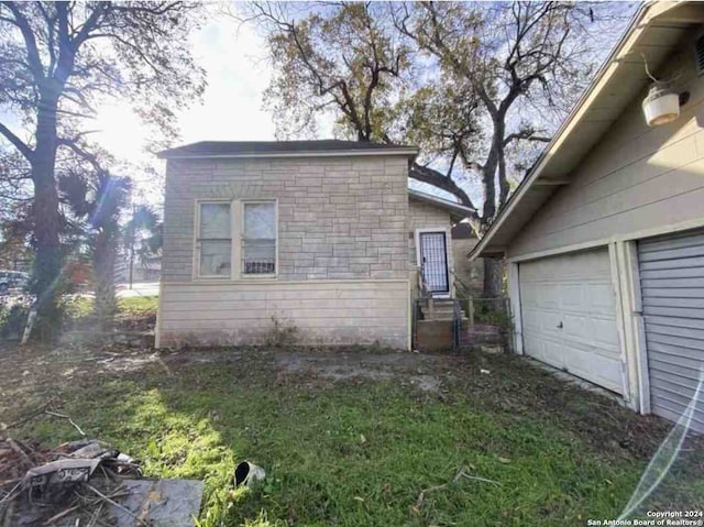 view of property exterior with a garage