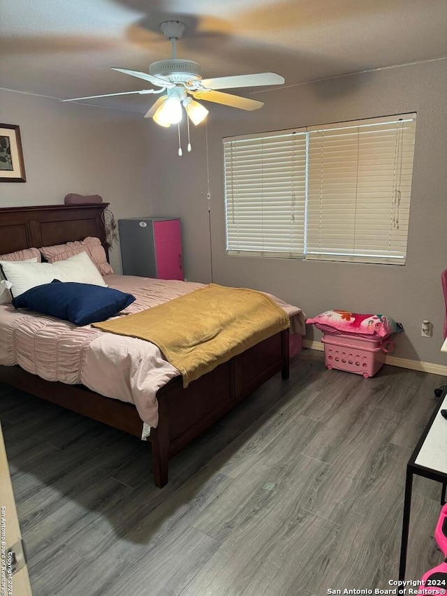 bedroom featuring wood-type flooring and ceiling fan