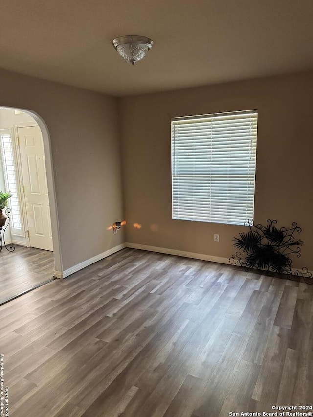 empty room with wood-type flooring