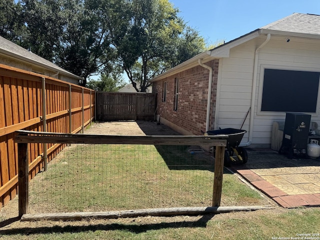 view of yard with a fenced backyard