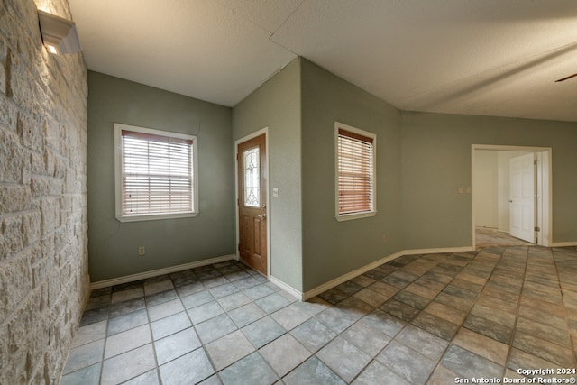 entryway with a textured ceiling