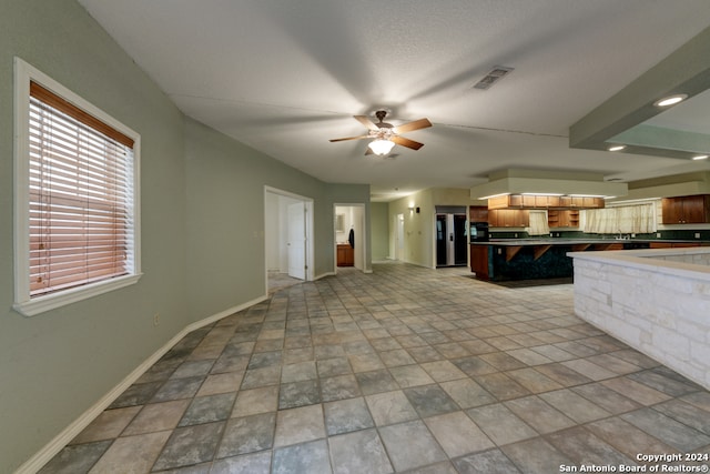 kitchen featuring stainless steel refrigerator with ice dispenser and ceiling fan