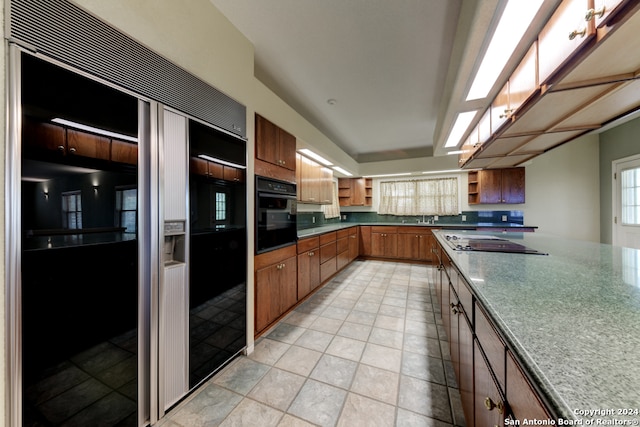 kitchen with black appliances and sink