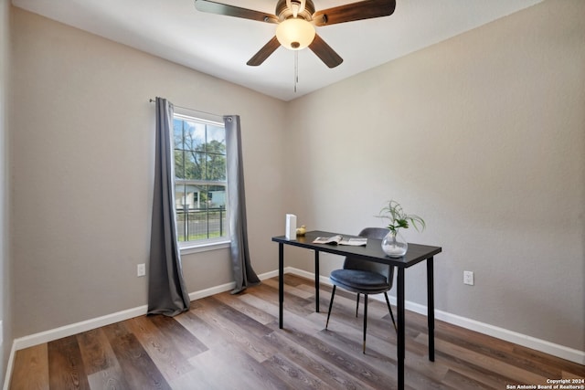 office space with ceiling fan and dark hardwood / wood-style flooring