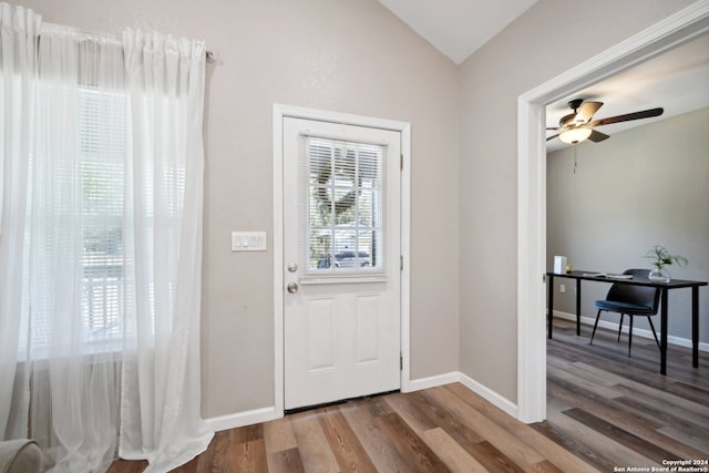 entryway with wood-type flooring, vaulted ceiling, and ceiling fan