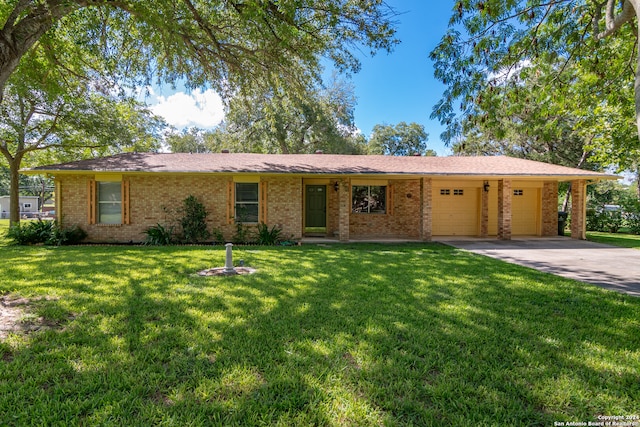 ranch-style home with a front yard and a garage